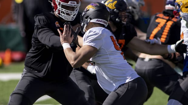 Jan 28, 2021; Mobile, Alabama, USA; National offensive lineman Adrian Ealy of Oklahoma (79) blocks National defensive lineman Elerson Smith of Northern Iowa (47) during National practice at Hancock Whitney Stadium.